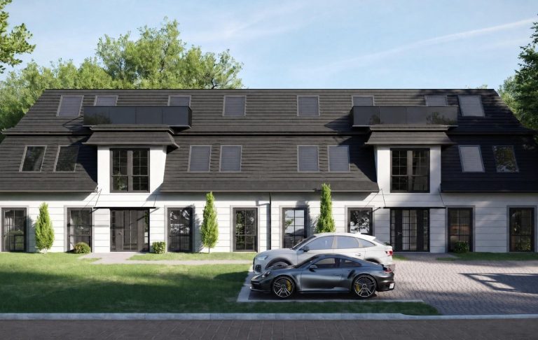 Modernes mehrstöckiges Gebäude mit hellem Stein, großen Fenstern und gepflegtem Garten.