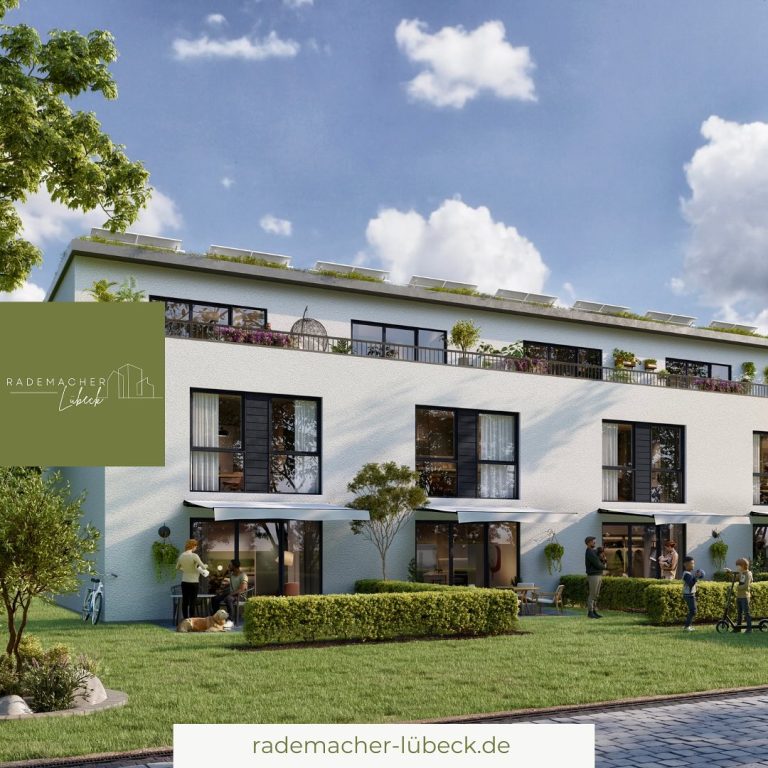 Moderne Mehrfamilienhäuser mit Grünflächen und Balkonen unter blauem Himmel.