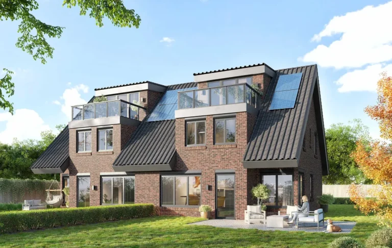 Modernes zweigeschossiges Haus mit großen Fenstern und einem begrünten Garten.