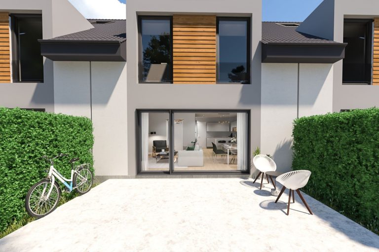 Moderne Fassade eines Hauses mit Holz-Elementen und Blick auf einen Gartenbereich.